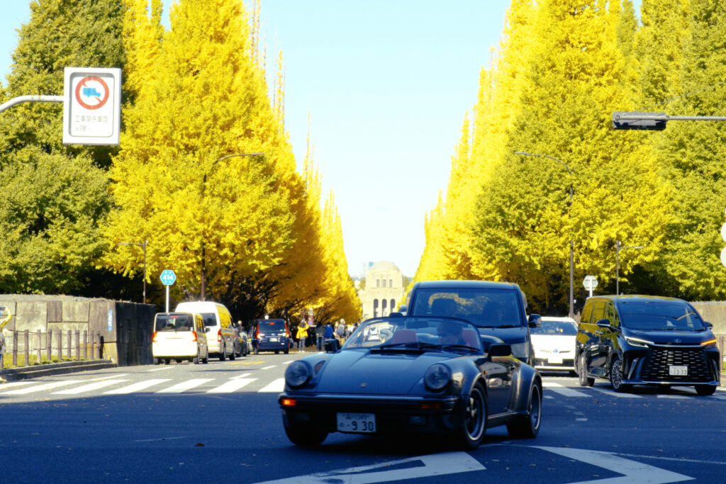 meiji jingu gaien ginkgo avenue in Meiji Jingu Gaien showing a luxury classic car and the autumn leaves