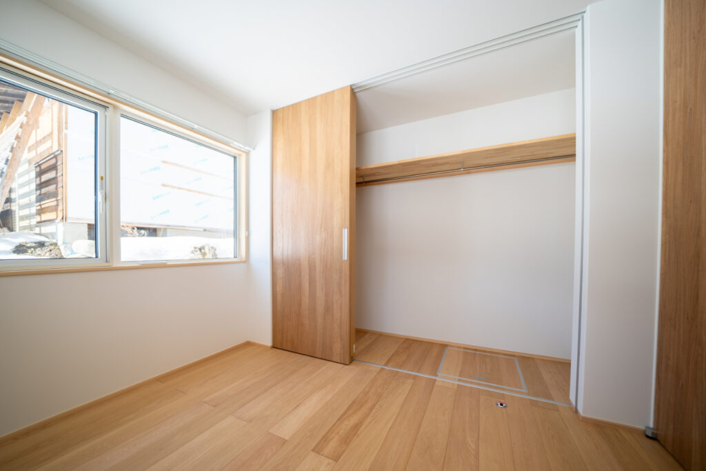 An image of the newly developed Iwatake Terrace Rental showing one of the two bedrooms with a large 