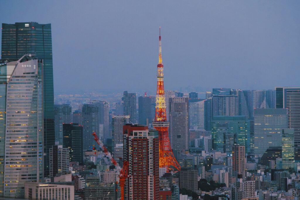An image of Tokyo, Minato with Tokyo tower and Roppongi hill and Azabudai hills jp mori tower at dusk