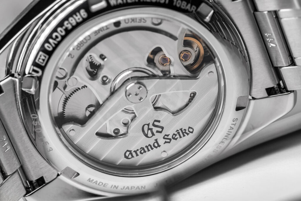 A close-up image of the Grand Seiko 9R65 Automatic Movement from the back of a watch.
