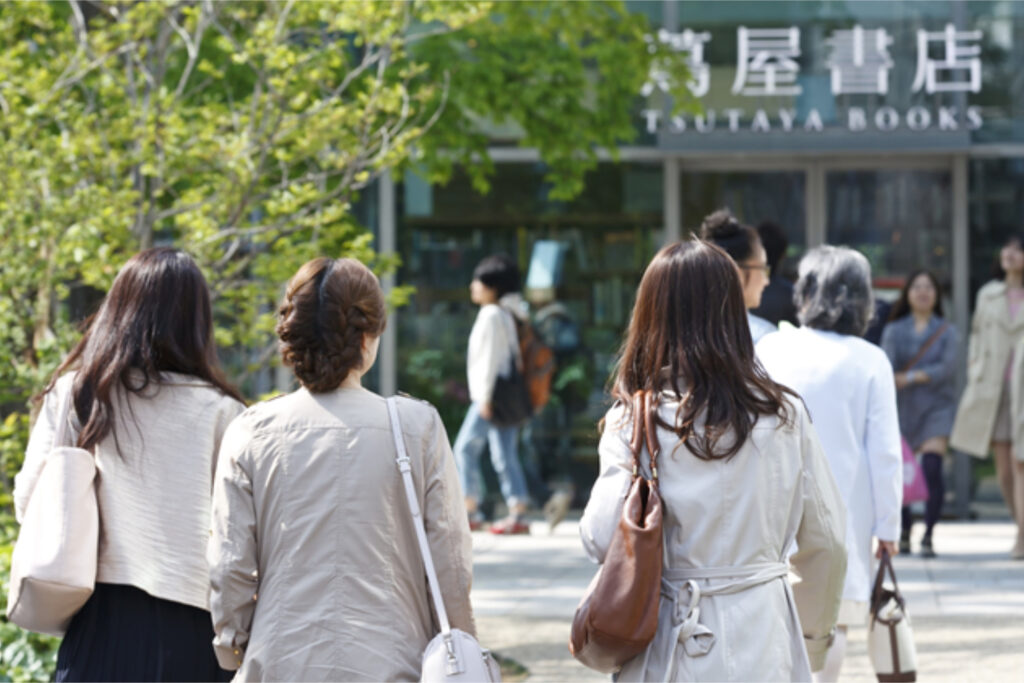 Daikanyama T-site exterior showing Tsutaya Book Store with 3 people walking towards it, Daikanyama area guide