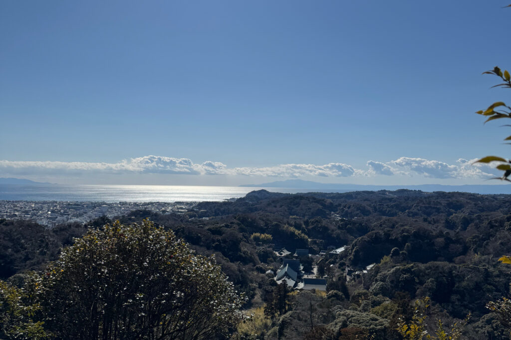 A view over Kenchō-ji Temple and Kamakura with the ocean in the background.