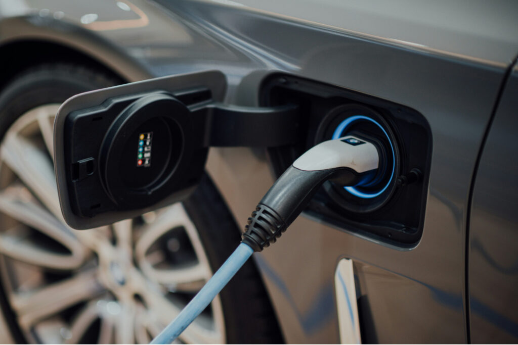 Charging cable connected to the charge port of an electric car.